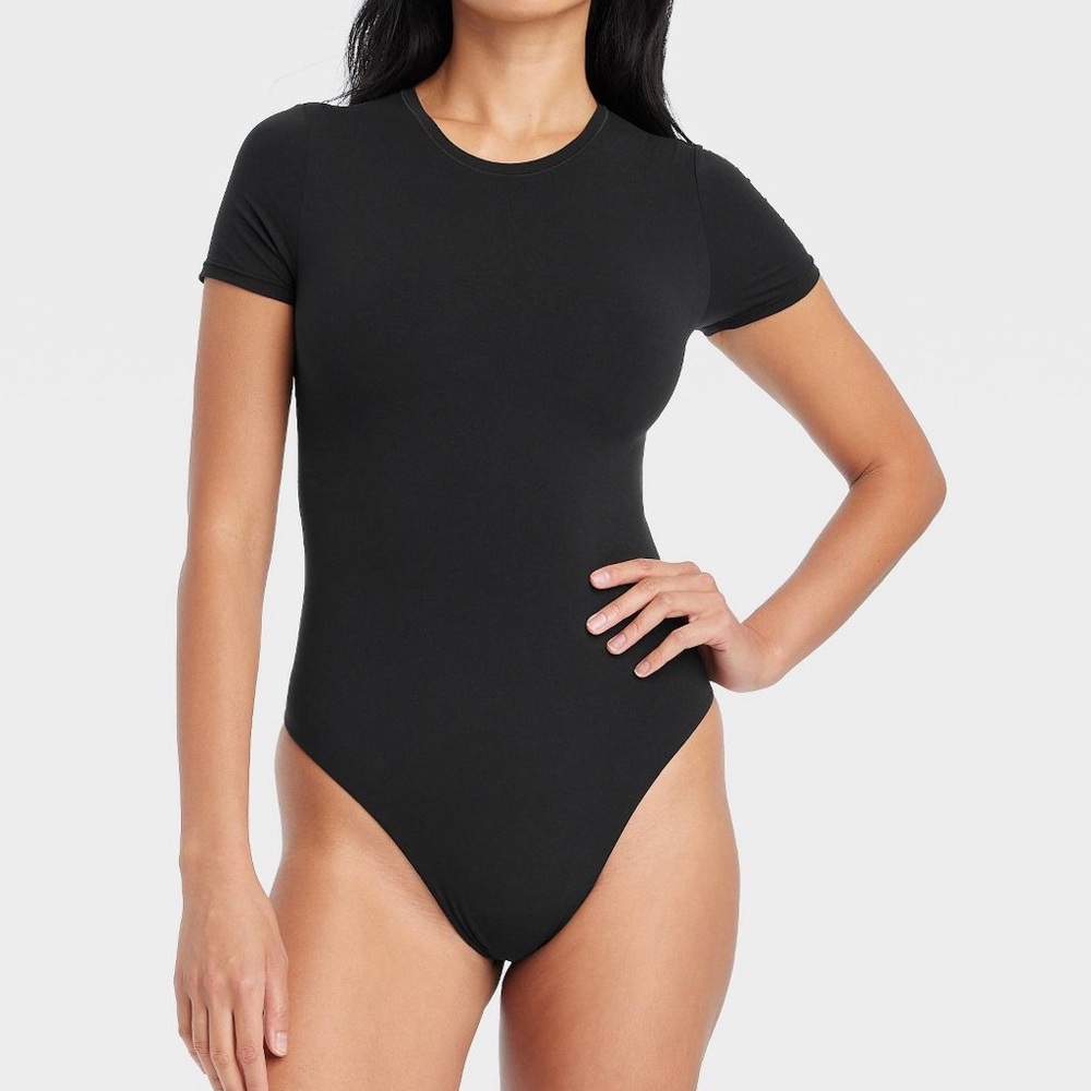Women’s Short Sleeve Stretch Body Suit. Color blue.     Size